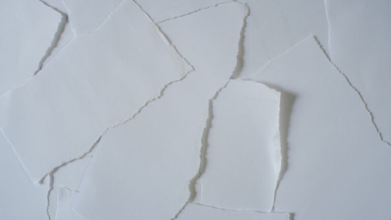 a piece of white paper that has been torn